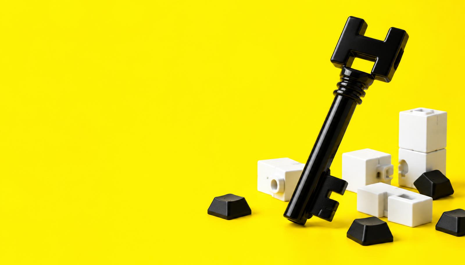 HIVEKEY black key on a bright yellow background